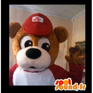 Brun bjørnemaskot med hue og rød og hvid sweater - Spotsound